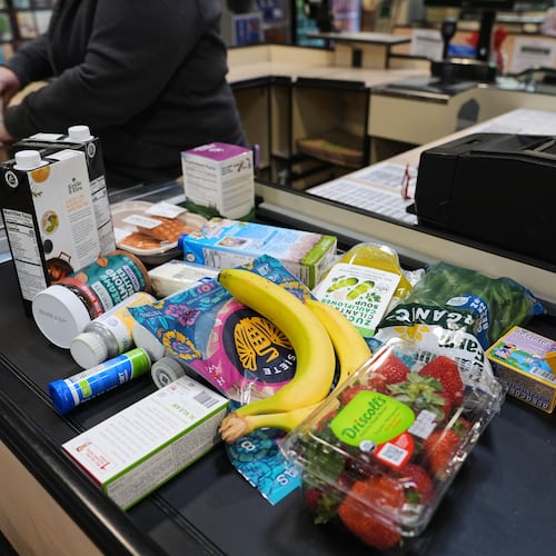 A cashier scans groceries, including produce, which is covered by the USDA Supplemental Nutrition Assistance Program (SNAP), at a grocery store in Baltimore, Monday, Nov. 10, 2025. (AP Photo/Stephanie Scarbrough)