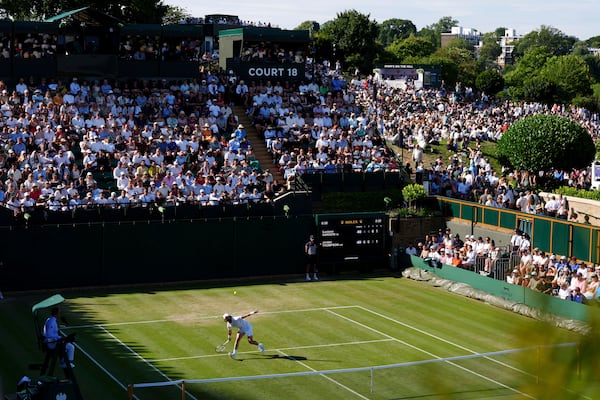 Australia's Jordan Thompson returns during his match against Italy's Luciano Darderi during their men's singles third round match on day five of the Wimbledon Tennis Championships in London, Friday July 4, 2025. (Ben Whitley/PA via AP)