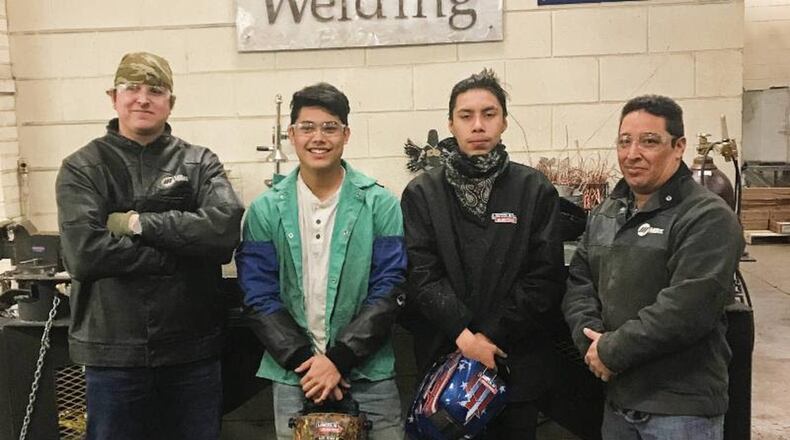 College and Career Institution welding students from Douglas County recently competed in the XCEL North GA Welding Competition. First place winner was Jaime Guevara from Alexander High School and third place was Samuel Jaimes from Lithia Springs High School. Josh Huey, lab assistant for welding instructor Ross Hollon, placed second. Pictured left to right are instructor Ross Hollon, Jaime Guevara, Samuel Jaimes, and lab assistant Charlie Diaz.