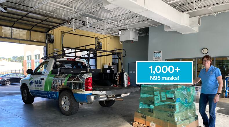 Bonnie Willis with the NW Metro Atlanta Habitat for Humanity stands beside the 1,000 N95 masks the organization donated to the Cobb & Douglas Public Health Department.