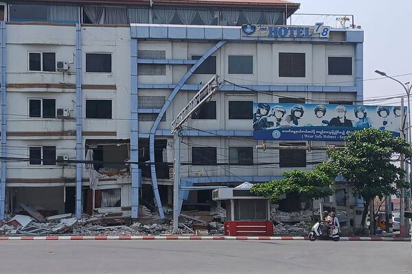 A scooterist rides past a hotel damaged by Friday's earthquake in Sagaing region, Myanmar, Tuesday, April 1, 2025. (Democratic Voice of Burma via AP)