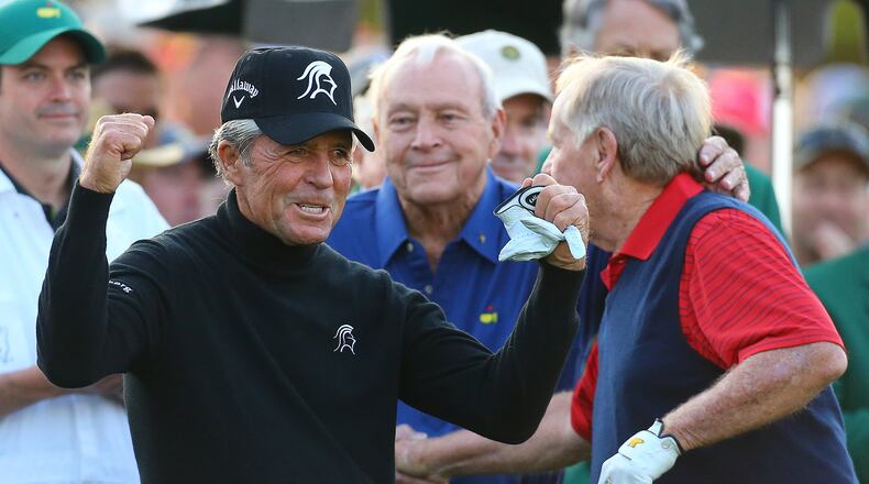 Golf’s Big Three: Gary Player, Arnold Palmer and Jack Nicklaus react on the tee box after hitting their shots to begin the Masters on Thursday, April 9, 2015. (Curtis Compton / ccompton@ajc.com)