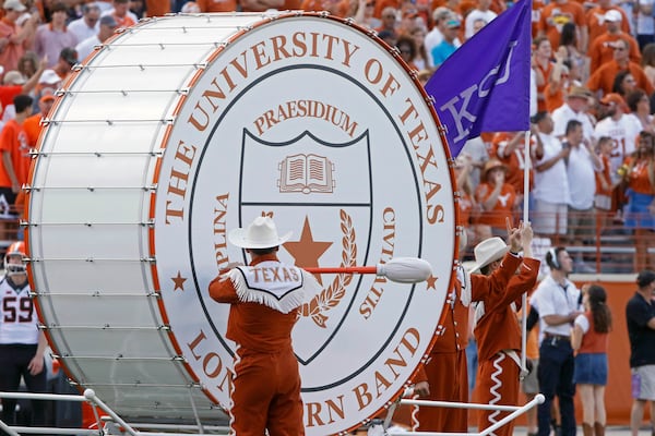 FILE - Texas' "Big Bertha" bass drum is played before the start of an NCAA college football game against Oklahoma State, Saturday, Oct. 21, 2017, in Austin, Texas. (AP Photo/Michael Thomas, File)