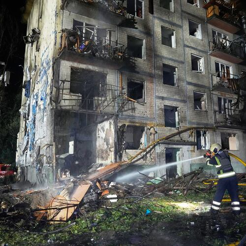 Emergency services personnel work to extinguish a fire following Russian missile attacks in Kyiv, Ukraine, Saturday, Aug. 1, 2026. (AP Photo/Efrem Lukatsky)