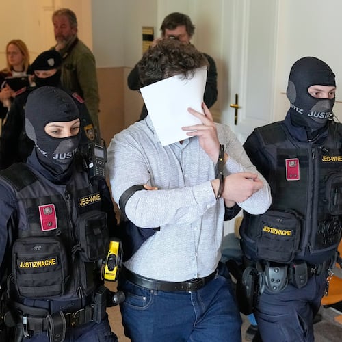 FILE - Defendant Beran A. is returned to the courtroom in the District Court in Wiener Neustadt, Austria, where he stands trial for plotting to carry out an attack on one of superstar singer Taylor Swift's concerts in Vienna in August 2024 and pledging allegiance to the Islamic State group, April 28, 2026. (AP Photo/Matthias Schrader, File)