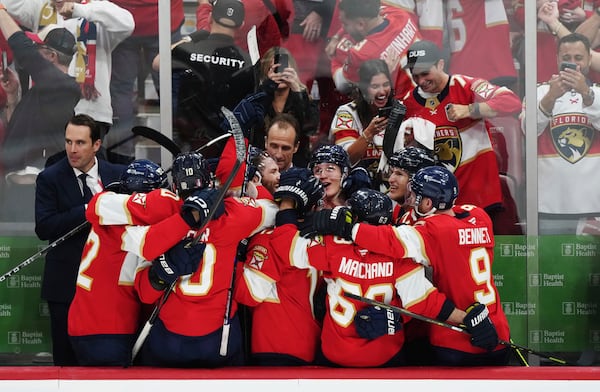 Florida Panthers players celebrate an empty net goal against the Edmonton Oilers during the third period in Game 6 of the NHL hockey Stanley Cup Final in Sunrise, Fla., Tuesday, June 17, 2025. (Nathan Denette/The Canadian Press via AP)