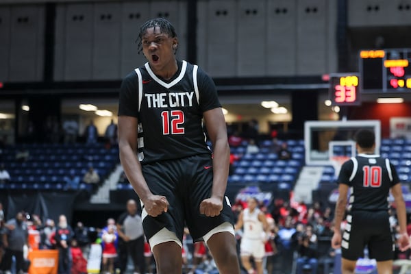 Tri-Cities forward Jalan Wingfield reacts after a dunk during the second half against Woodward Academy in the GHSA Boys 5A State Championship at the Macon Centreplex, Friday, March, 7, 2025, in Macon, Ga. Tri-Cities won 66-55. (Jason Getz/AJC)
