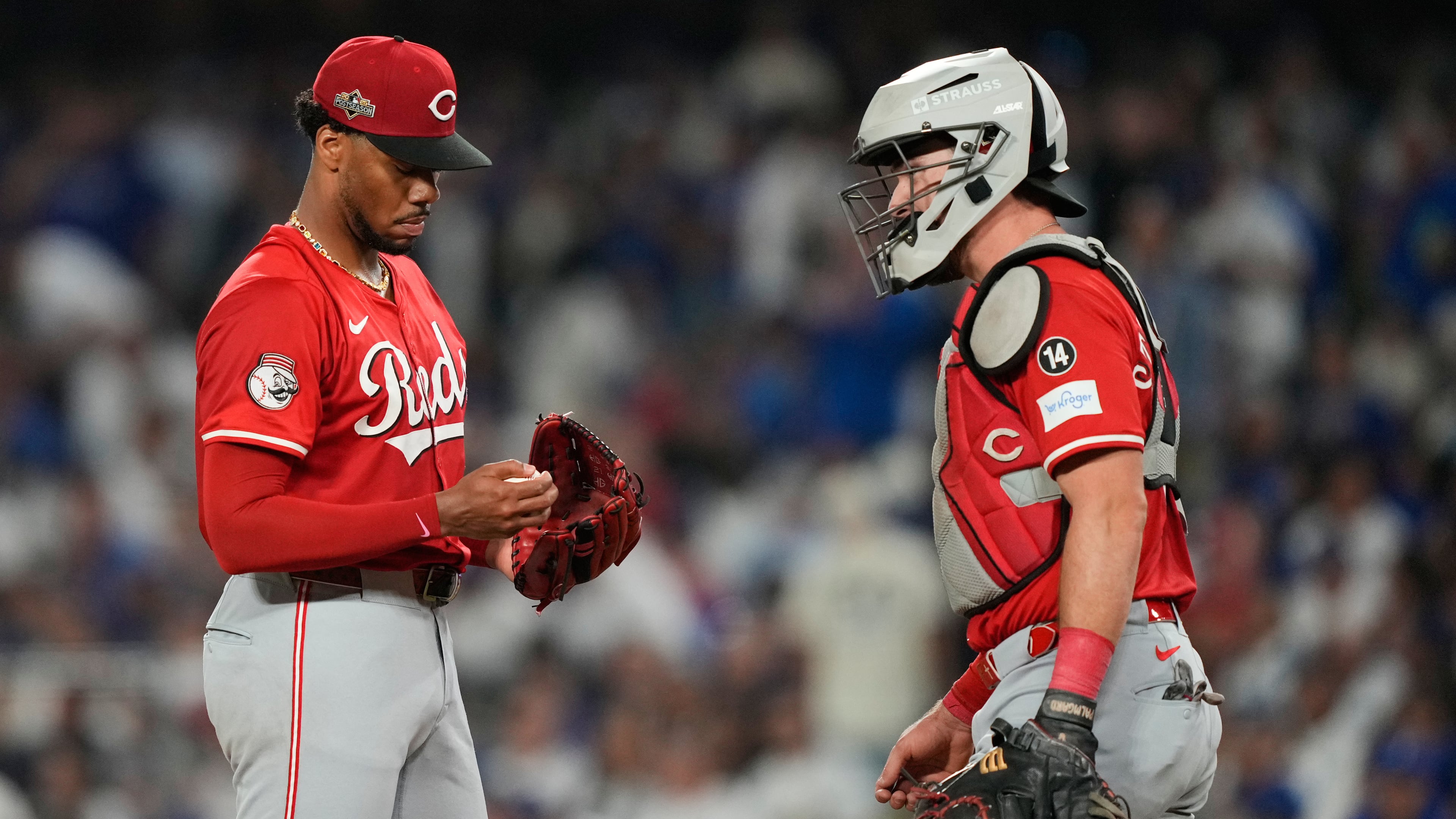 Cincinnati Reds pitcher Hunter Greene gets a visit to the mound from catcher Tyler Stephenson after Greene gave up a solo home run to Los Angeles Dodgers' Tommy Edman during the third inning in Game 1 of the National League Wild Card baseball playoff series Tuesday, Sept. 30, 2025, in Los Angeles. (AP Photo/Mark J. Terrill)