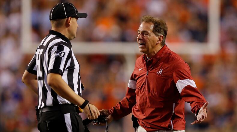 Alabama head coach Nick Saban argues a call with head linesman Thomas Eaton during the loss to the Tigers Nov. 30, 2019, at Jordan Hare Stadium in Auburn, Ala.