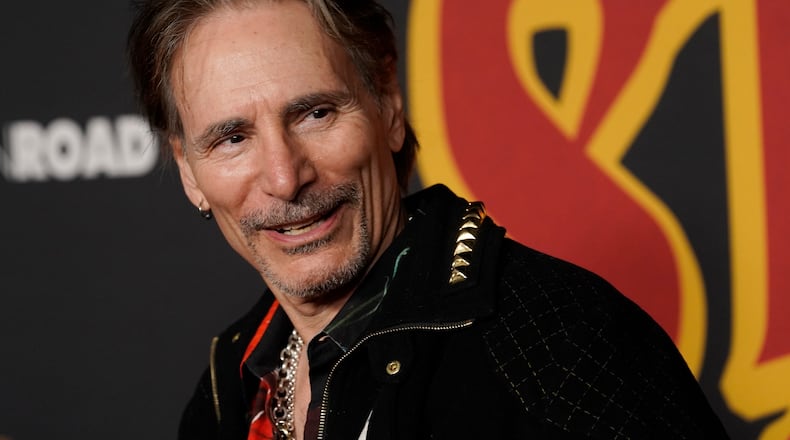 Guitarist Steve Vai arrives at the premiere of the film "Studio 666," Wednesday, Feb. 16, 2022, at the TCL Chinese Theatre in Los Angeles. (AP Photo/Chris Pizzello)