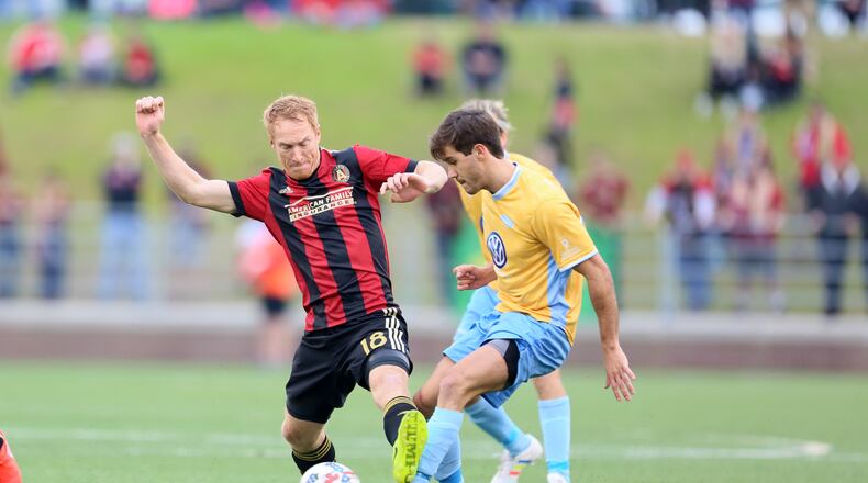 Midfielder Jeff Larentowicz (18) makes a tackle in Saturday’s game against Chatttanooga. (Miguel Martinez)