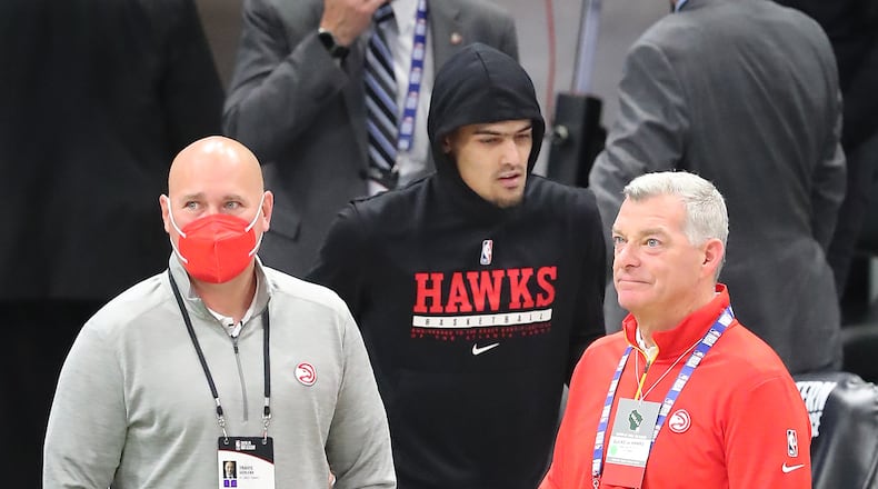 Hawks general manager Travis Schlenk, point guard Trae Young and team owner Tony Ressler. “Curtis Compton / Curtis.Compton@ajc.com”