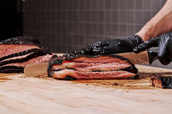 Beef brisket at Lewis Barbecue. Central Texas-style BBQ is characterized by beef, especially brisket, smoked over indirect heat from Texas oak. It shouldn't need a sauce. (Andrew Thomas Lee/Courtesy of Lewis Barbecue)