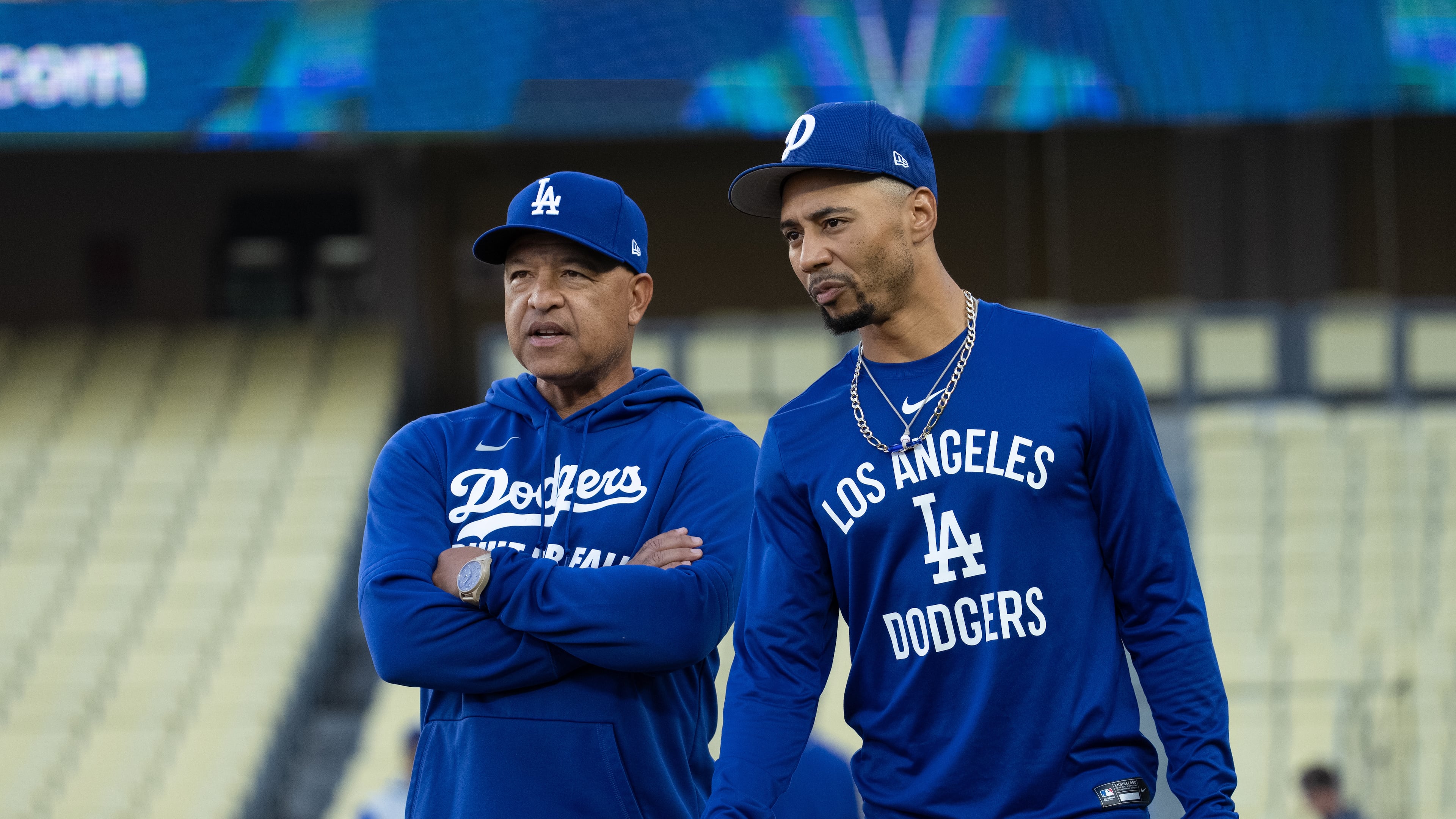 Los Angeles Dodgers manager Dave Roberts, left, talks with Mookie Betts during practice Tuesday, Oct. 7, 2025, in Los Angeles, the day before Game 3 of baseball's National League Division Series against the Philadelphia Phillies. (AP Photo/Jae C. Hong)