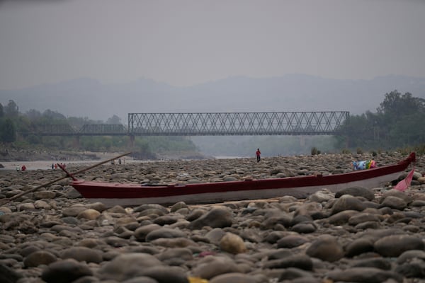 A boat stands still at the dry Chenab river after the water was halted from a dam, at Akhnoor, on the outskirts of Jammu, India, Monday, May 5, 2025. (AP Photo/Channi Anand)