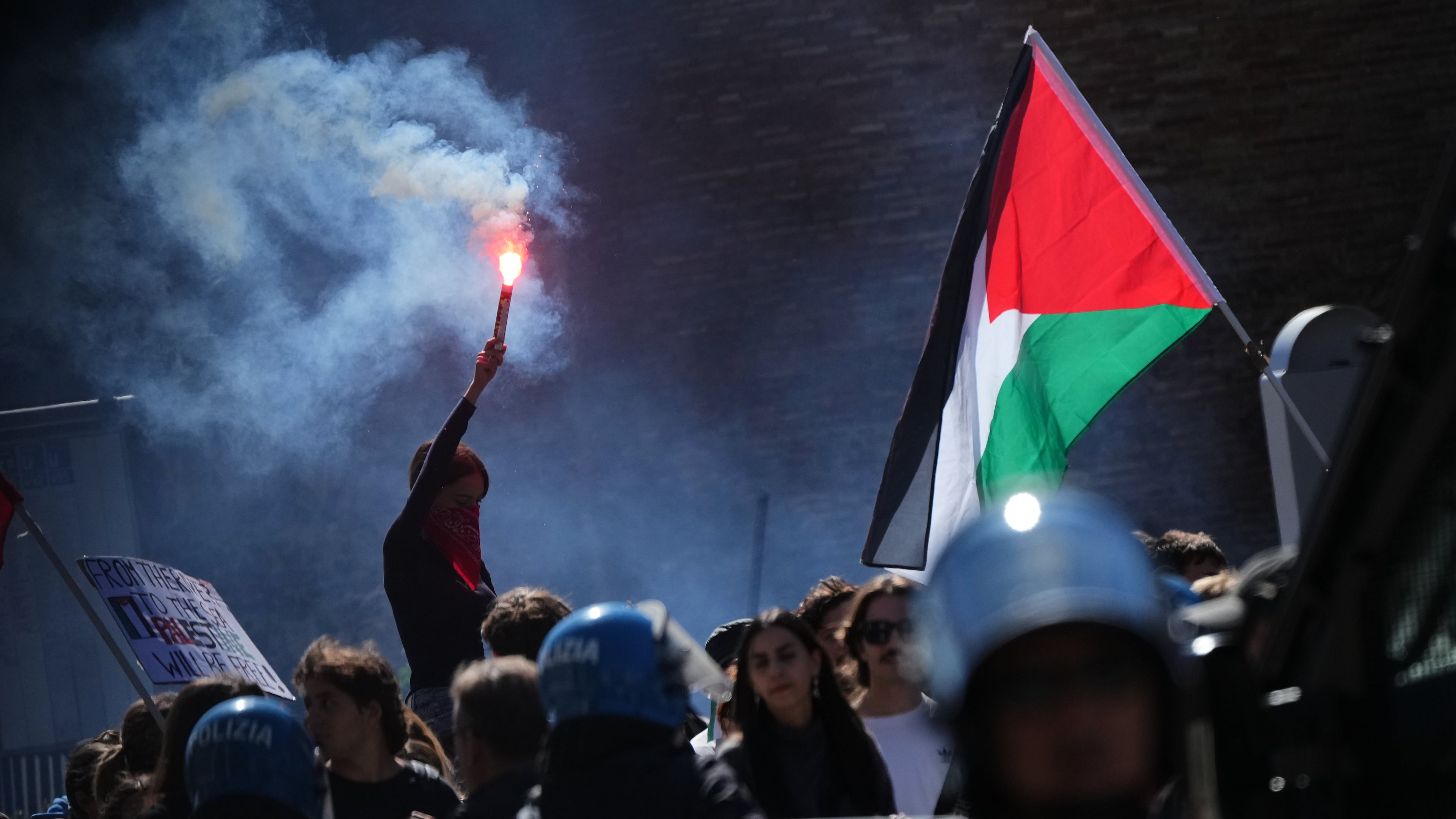 Pro-Palestinian demonstrators gather for a national general strike called by different unions to protest against the situation in Gaza two days after Israeli forces intercepted a Gaza-bound aid flotilla in the Mediterranean Sea, in Rome, Friday, Oct. 3, 2025. (AP Photo/Alessandra Tarantino)
