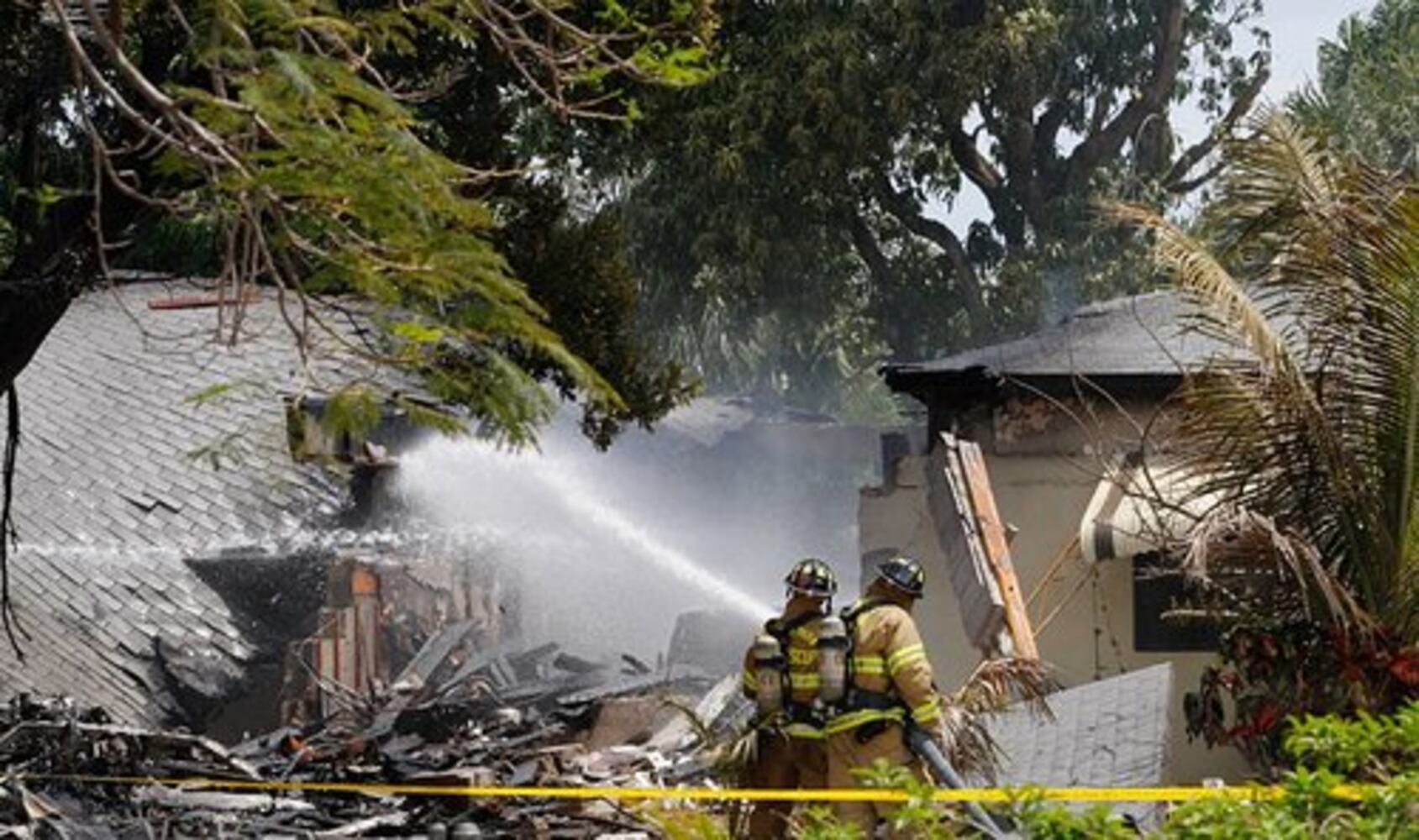 Plane crashes into house