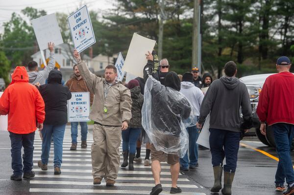 Pratt & Whitney employees hold signs while picketing at the Silver Lane entrance in East Hartford, Conn., on the first day of their strike, Monday, May 5, 2025. (Aaron Flaum/Hartford Courant via AP)