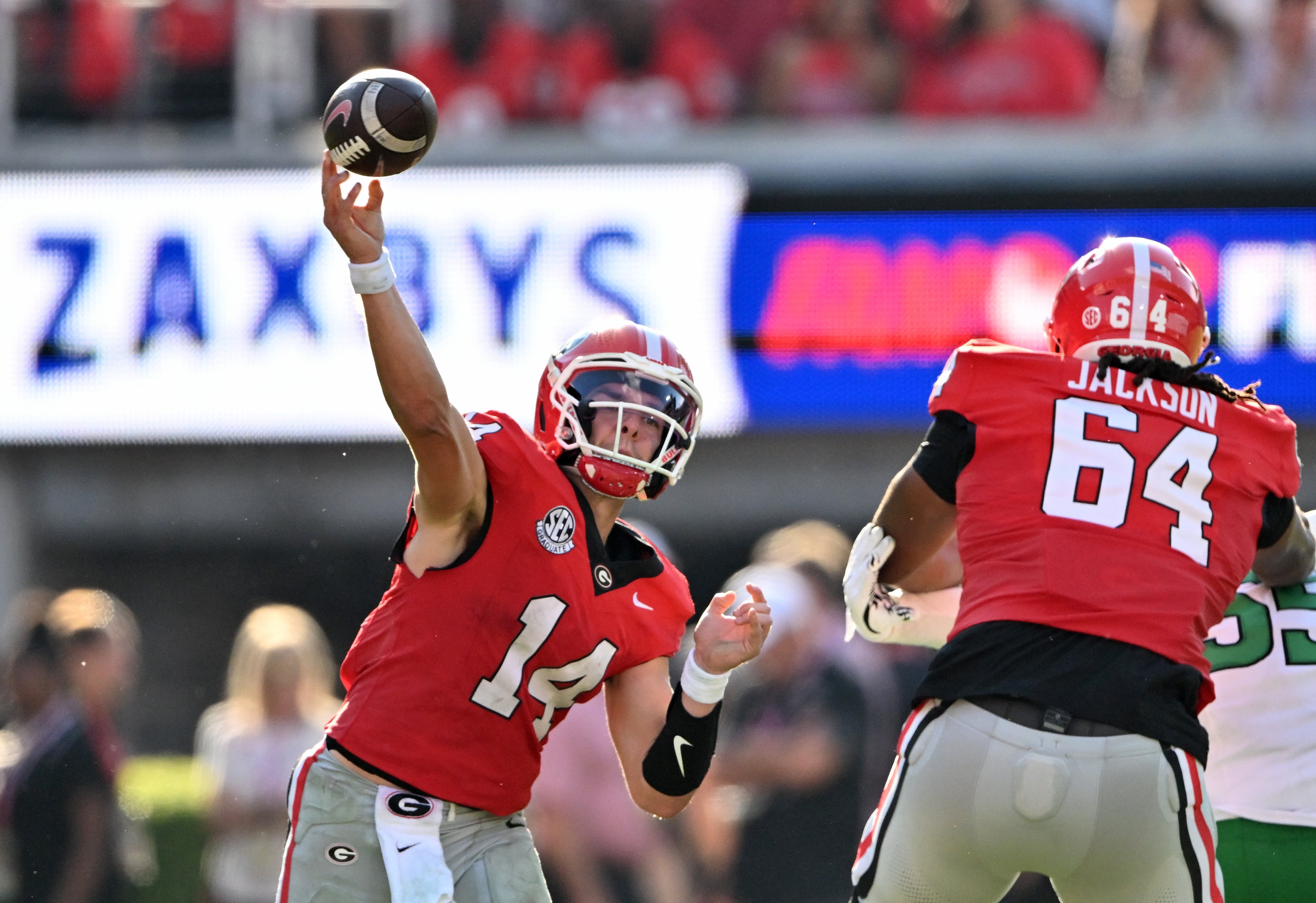 Georgia quarterback Gunner Stockton (14) gets off a pass during the second half in an NCAA football game at Sanford Stadium, Saturday, August 30, 2025, in Athens. Georgia won 45-7 over Marshall. (Hyosub Shin / AJC)