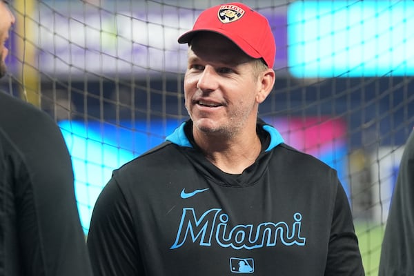 Miami Marlins manager Clayton McCullough wears a Florida Panthers cap before a baseball game against the San Francisco Giants, Friday, May 30, 2025, in Miami. (AP Photo/Lynne Sladky)