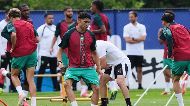 Morocco's Achraf Hakimi exercises during a training session ahead of the World Cup Group C soccer match between Scotland and Morocco in Foxborough, Mass., near Boston, Thursday, June 18, 2026. (AP Photo/Martin Meissner)