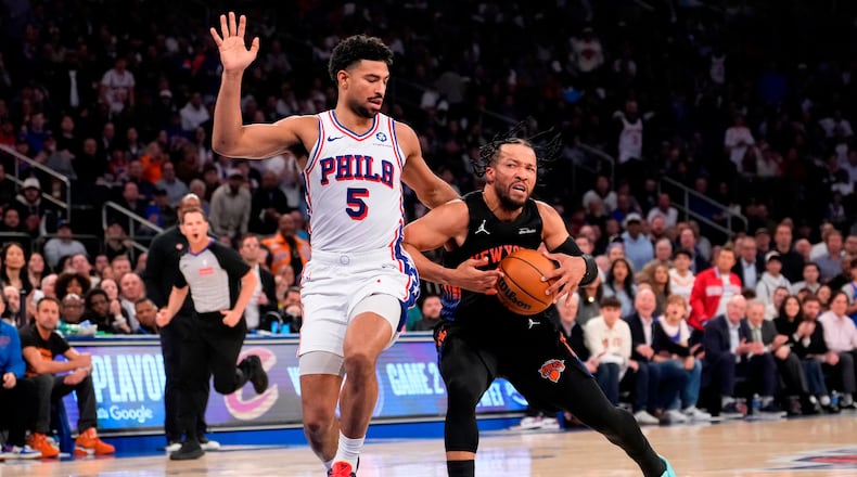 New York Knicks guard Jalen Brunson, right, drives past Philadelphia 76ers guard Quentin Grimes (5) during the first half of Game 2 in a second-round NBA basketball playoffs series, Wednesday, May 6, 2026, in New York. (AP Photo/Yuki Iwamura)