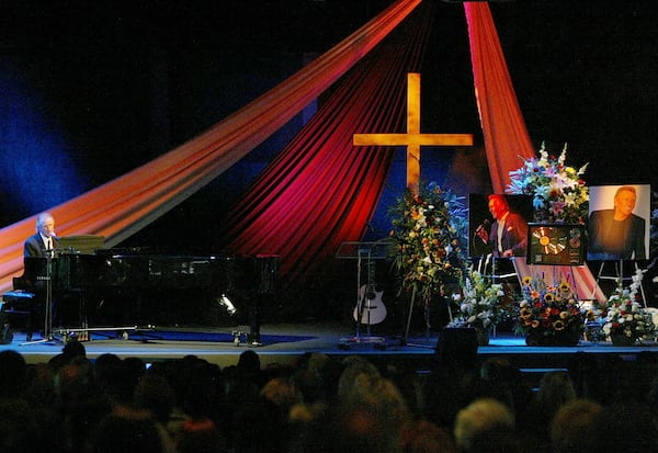 Bill Medley (left) sings "Precious Lord" during a memorial service for Bobby Hatfield — his partner in the Righteous Brothers — in 2003. (Nam Y. Huh/AP 2003)