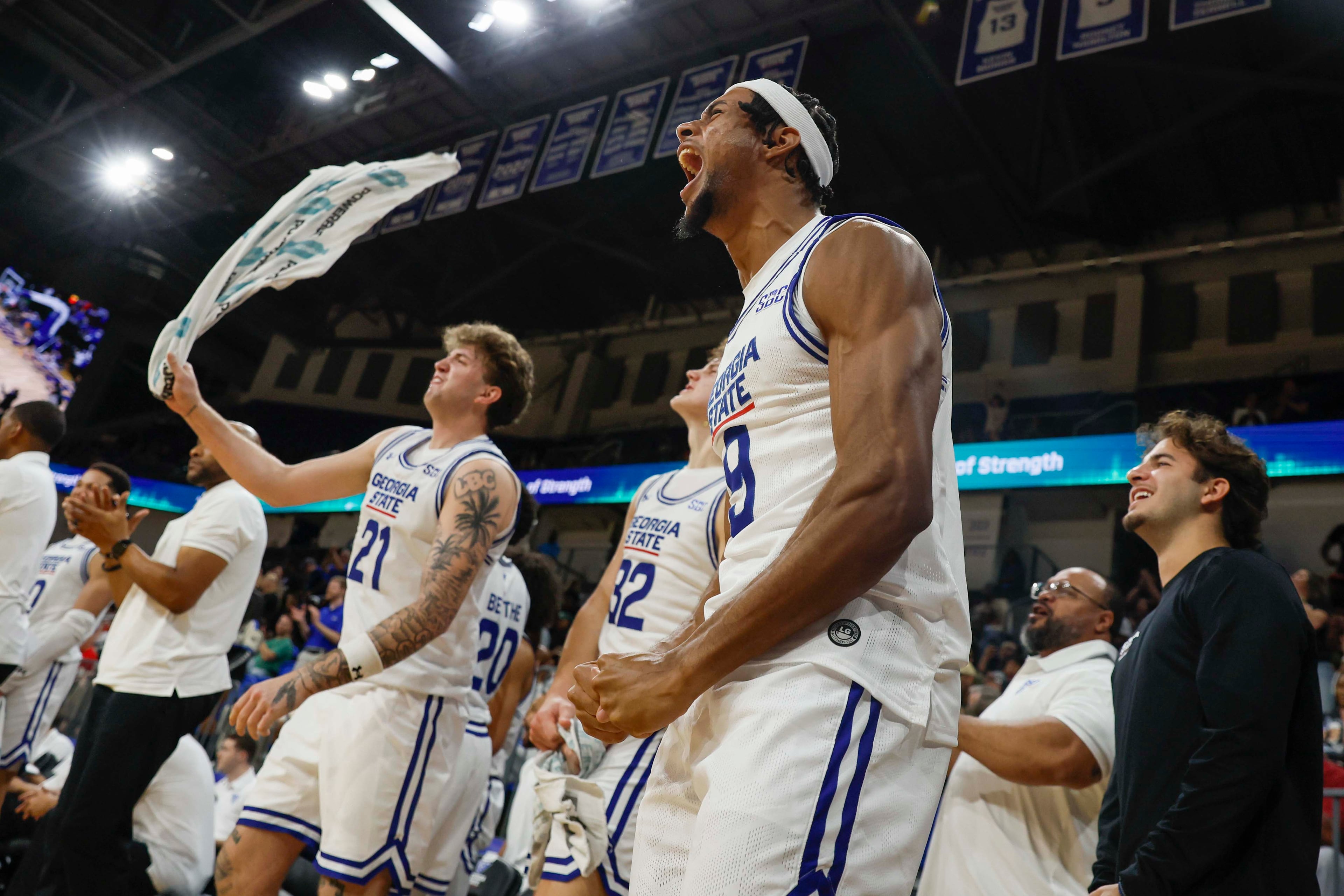 Georgia State Panthers bench players react after a teammate made a three-pointer during the second half of an exhibition opener game against the Georgia Bulldogs at the Georgia State Convocation Center, Wednesday, October 15, 2025, in Atlanta. (Miguel Martinez/ AJC)