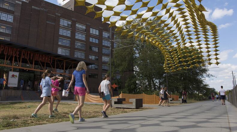 Visitors walk along the Atlanta Beltline at Ponce City Market in Atlanta, on Monday, October 17, 2016. (DAVID BARNES / DAVID.BARNES@AJC.COM)