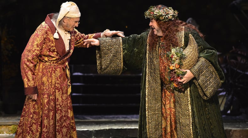 David De Vries (left) and Bart Hansard reprise their roles as Ebenezer Scrooge and the Ghost of Christmas Present in “A Christmas Carol” at the Alliance Theatre in 2018. PHOTO CREDIT: Greg Mooney