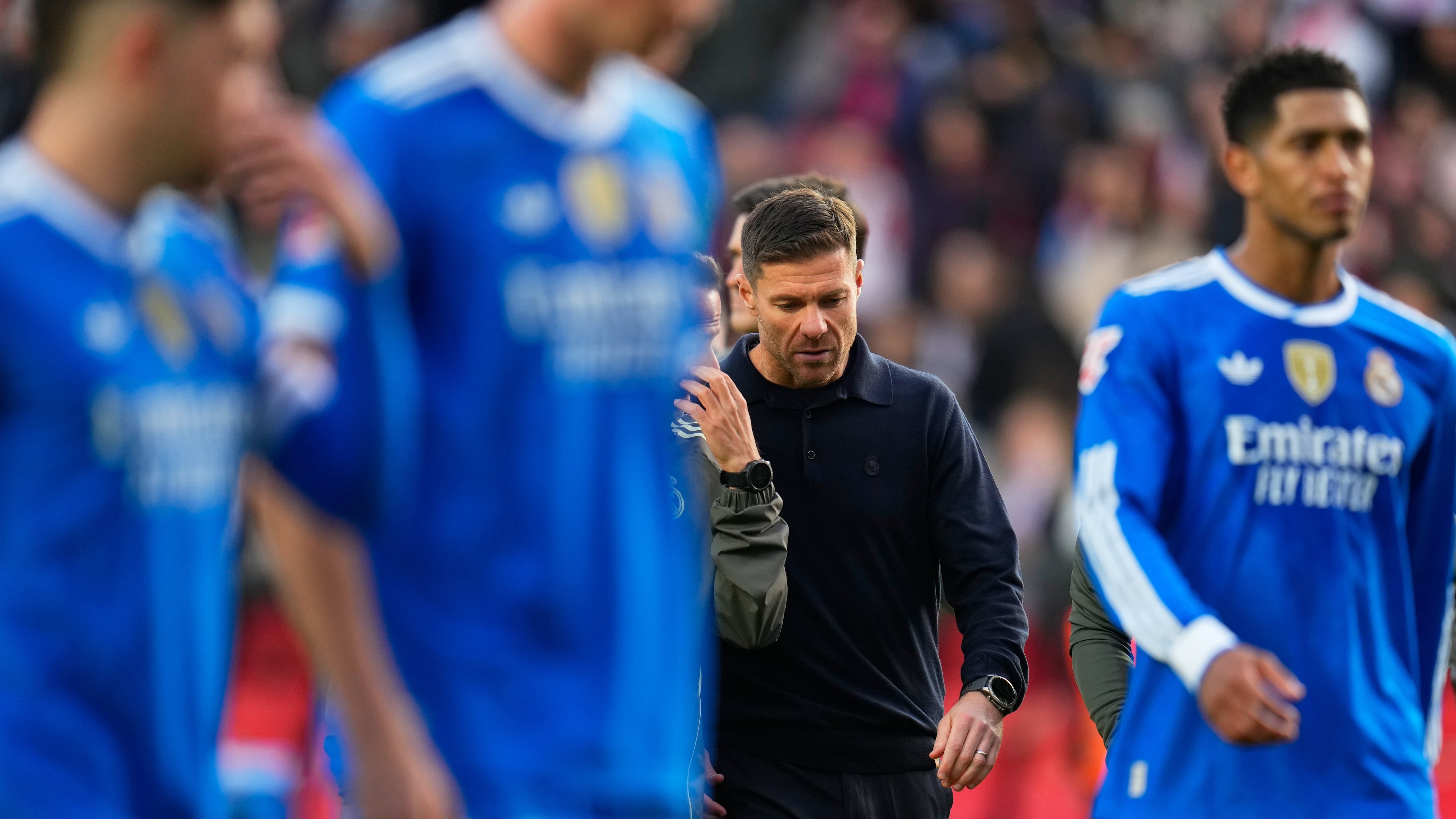 Real Madrid's head coach Xabi Alonso walks with the players during a Spanish La Liga soccer match between Rayo Vallecano and Real Madrid in Madrid, Spain, Sunday, Nov. 9, 2025. (AP Photo/Manu Fernandez)