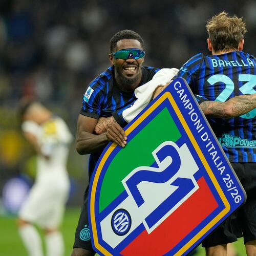 Inter Milan's Marcus Thuram, left, and Inter Milan's Nicolo Barella celebrate their victory at the Serie A soccer match between Inter Milan and Parma, in Milan, Italy, Sunday, May 3, 2026. (AP Photo/Luca Bruno)