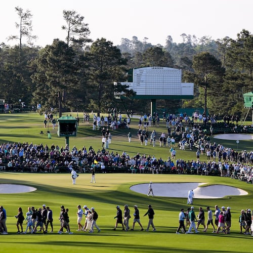Fans walk on the second hole during the first round of the Masters golf tournament at the Augusta National Golf Club, Thursday, April 9, 2026, in Augusta, Ga. (AP Photo/Ashley Landis)
