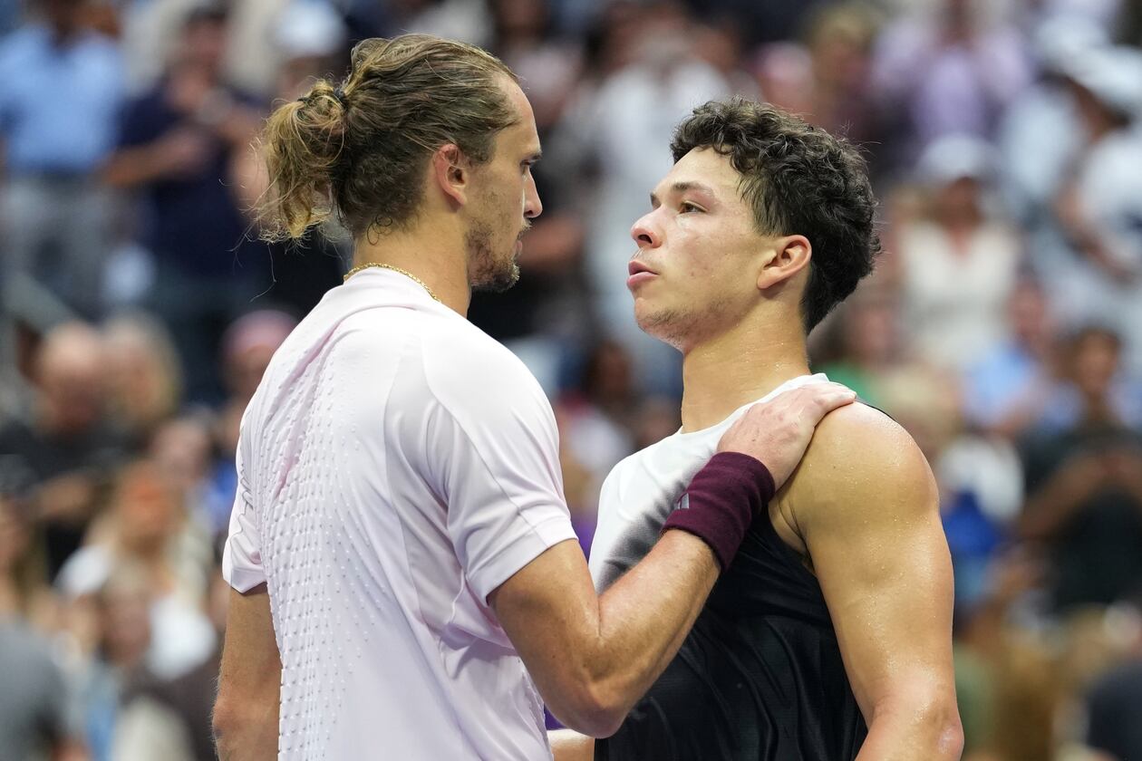 Alexander Zverev, of Germany, left, greets Ben Shelton, of the United States, after Zverev won the men's singles final of the U.S. Open tennis championships Sunday, Sept. 13, 2026, in New York. (AP Photo/Kirsty Wigglesworth)