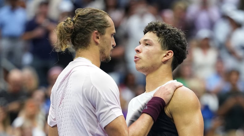 Alexander Zverev, of Germany, left, greets Ben Shelton, of the United States, after Zverev won the men's singles final of the U.S. Open tennis championships Sunday, Sept. 13, 2026, in New York. (AP Photo/Kirsty Wigglesworth)