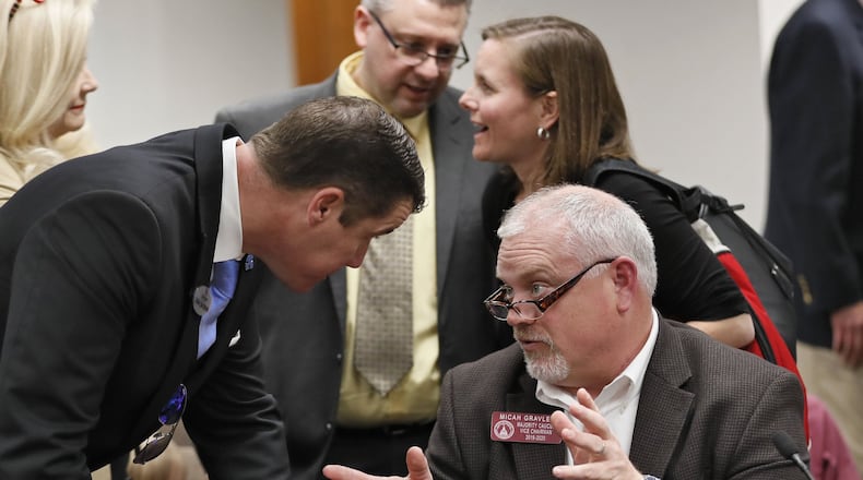 Supporters of Georgia medical marijuana legislation gather around the bill’s sponsor, Rep. Micah Gravley, R-Douglasville, following a Senate committee’s passage of a watered-down version of the bill on Wednesday, March 27, 2019, at the state Capitol in Atlanta.