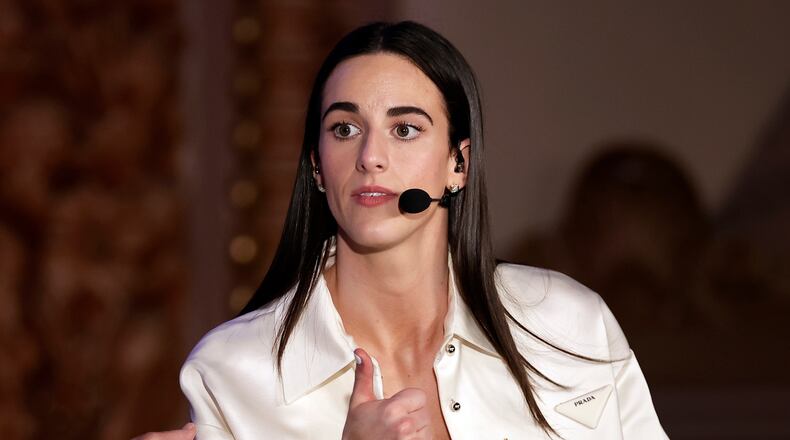 FILE - Indiana Fever's Caitlin Clark reacts during an interview during the WNBA basketball draft, April 15, 2024, in New York. (AP Photo/Adam Hunger, File)