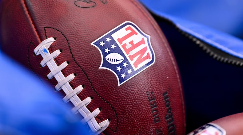 FILE - A detail view of the NFL shield on a football prior to an NFL football game between the Houston Texans and the Indianapolis Colts on Jan. 4, 2026, in Houston. (AP Photo/Maria Lysaker, File)