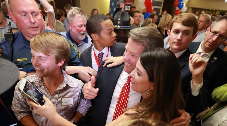 Brian Kemp, now the Republican nominee for governor, pauses for a selfie with a supporter (and the actor who played “Jake” in his TV ads) after his victory speech on Tuesday in Athens. Curtis Compton,ccompton@ajc.com