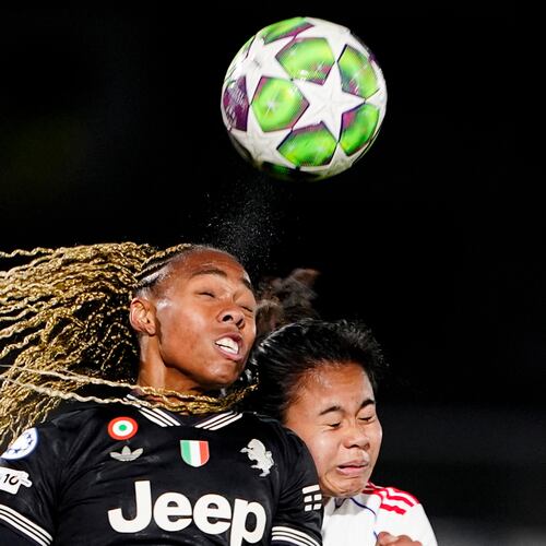 OL Lyonnes's Alice Sombath, right, jumps for the ball with Juventus' Lindsey Thomas during the women's Champions League soccer match between Juventus and OL Lyonnes in Biella, Italy, Wednesday, Nov. 19, 2025. (Fabio Ferrari/LaPresse via AP)