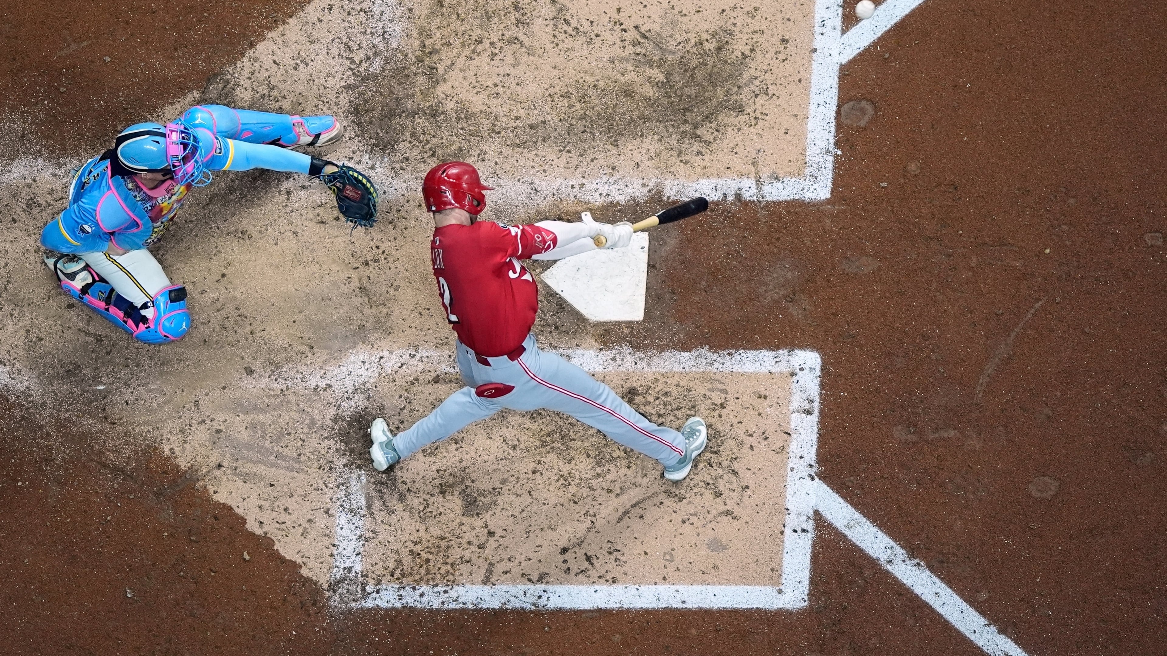 Cincinnati Reds' Gavin Lux hits a double during the sixth inning of a baseball game against the Milwaukee Brewers Friday, Sept. 26, 2025, in Milwaukee. (AP Photo/Morry Gash)