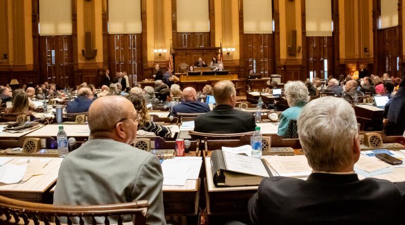 Floor level of the Georgia House Chamber with the backs of lawmakers