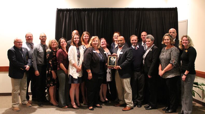 Gwinnett Community Services Director Tina Fleming, Director and Recreation Deputy Director Chris Minor receive the Agency of the Year Award along with employees of Gwinnett Parks and Recreation. Courtesy Gwinnett County