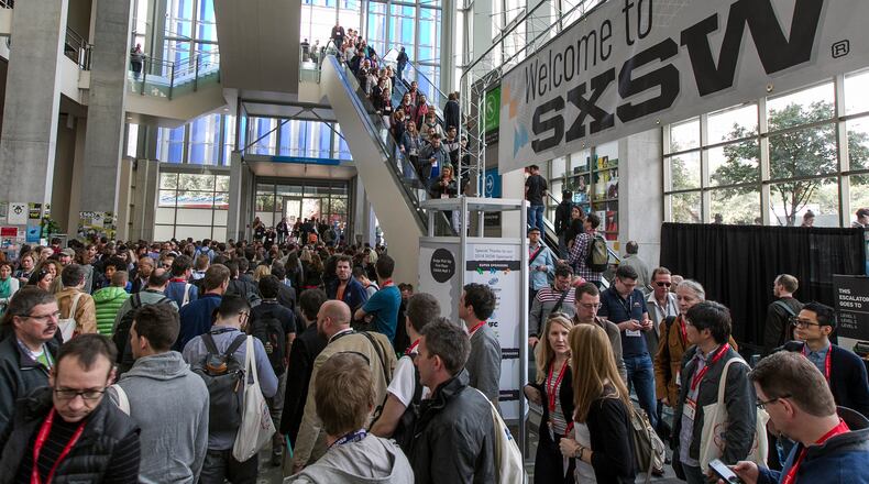 Thousands attending the first day of SXSW Interactive  2014 navigate the halls of the Austin Convention Center on Friday, March 7, 2014.