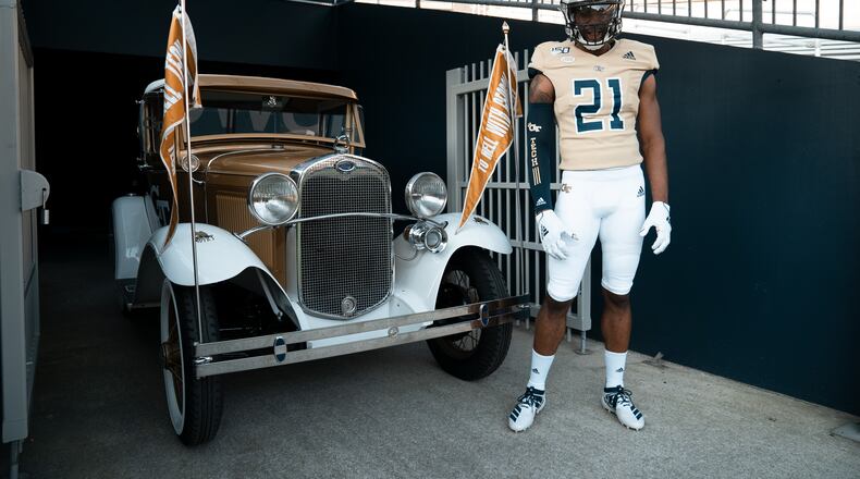 Georgia Tech wide receiver Stephen Dolphus models the gold jersey that the Yellow Jackets will wear in their September 14, 2019 home game against The Citadel. (Santino Stancato/Georgia Tech Football)