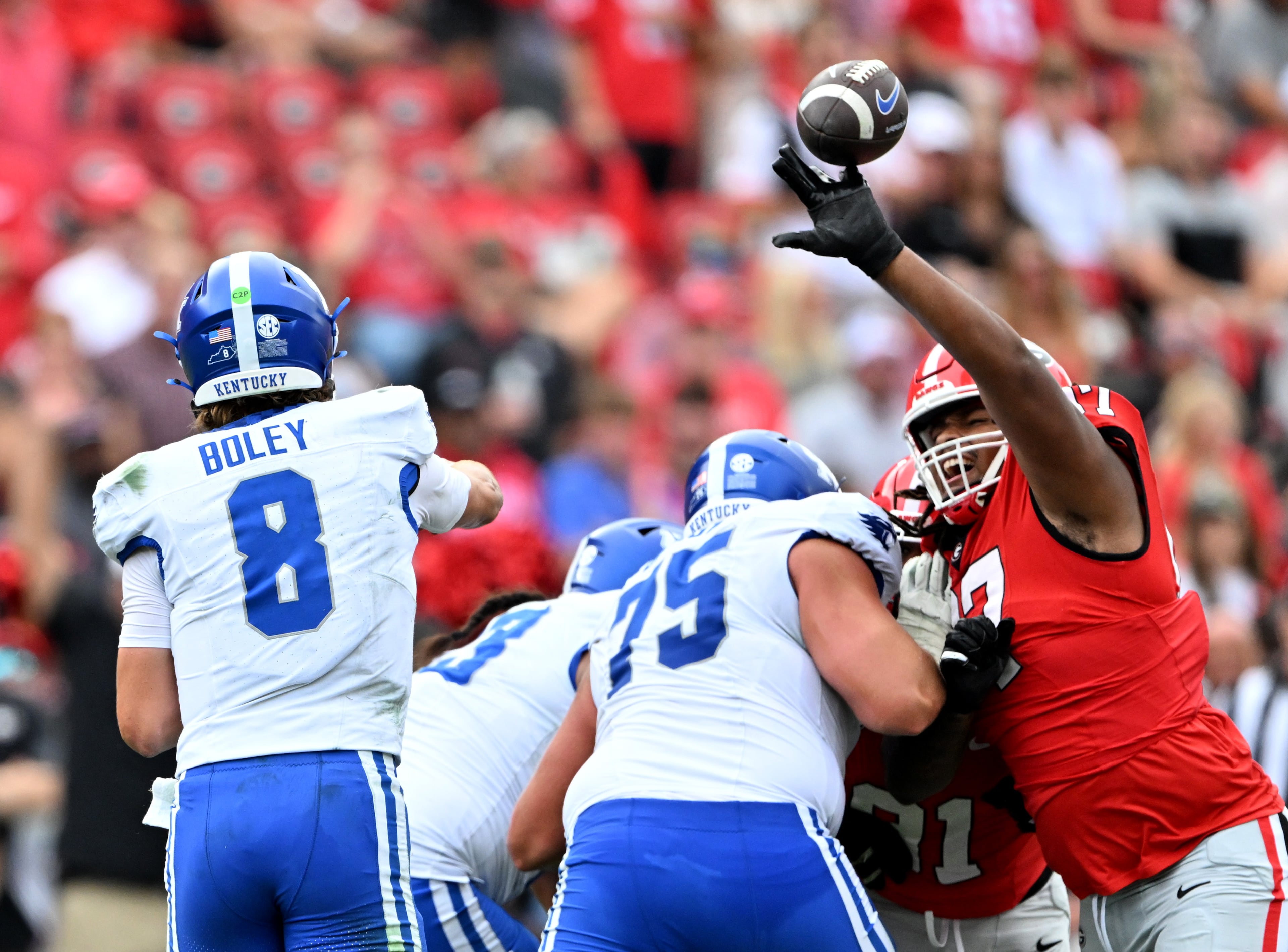 Georgia defensive lineman Jordan Thomas (97) interferes a pass by Kentucky quarterback Cutter Boley (8) during the second half in a NCAA college football game at Sanford Stadium, Saturday, October 4, 2025, in Athens. Georgia won 35 -14 over Kentucky. (Hyosub Shin / AJC)