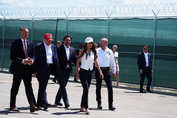 President Donald Trump, Gov. Ron DeSantis, R-Fla., Homeland Security Secretary Kristi Noem and others, tour "Alligator Alcatraz," a new migrant detention facility at Dade-Collier Training and Transition facility, Tuesday, July 1, 2025, in Ochopee, Fla. (AP Photo/Evan Vucci)