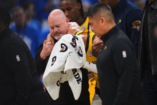 Indiana Pacers guard Tyrese Haliburton (0) leaves the court with an injury during the first half of Game 7 of the NBA Finals basketball series against the Oklahoma City Thunder Sunday, June 22, 2025, in Oklahoma City. (AP Photo/Julio Cortez)