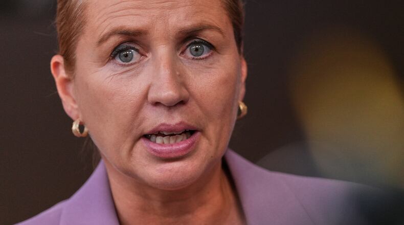 FILE - Denmark's Prime Minister Mette Frederiksen talks to journalists as she arrives for the EU summit in Brussels, Thursday, June 18, 2026. (AP Photo/Marius Burgelman, File)