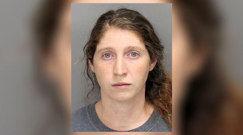 Ashley Marie Davis was charged with two counts each of aggravated cruelty to animals and abandonment of a domesticated animal.